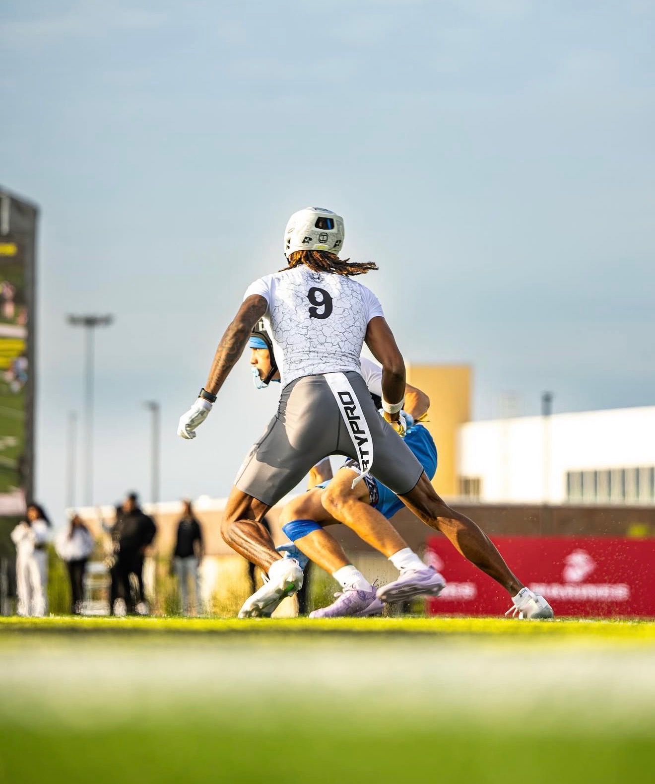 John Meredith III, No. 9, accelerating during a high school 7-on-7 drill
